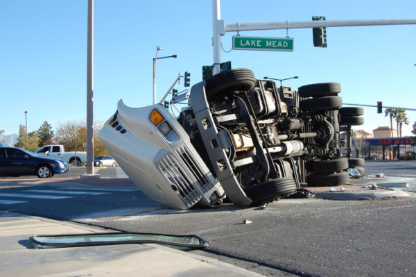 An overturned tractor-trailer in an intersection.